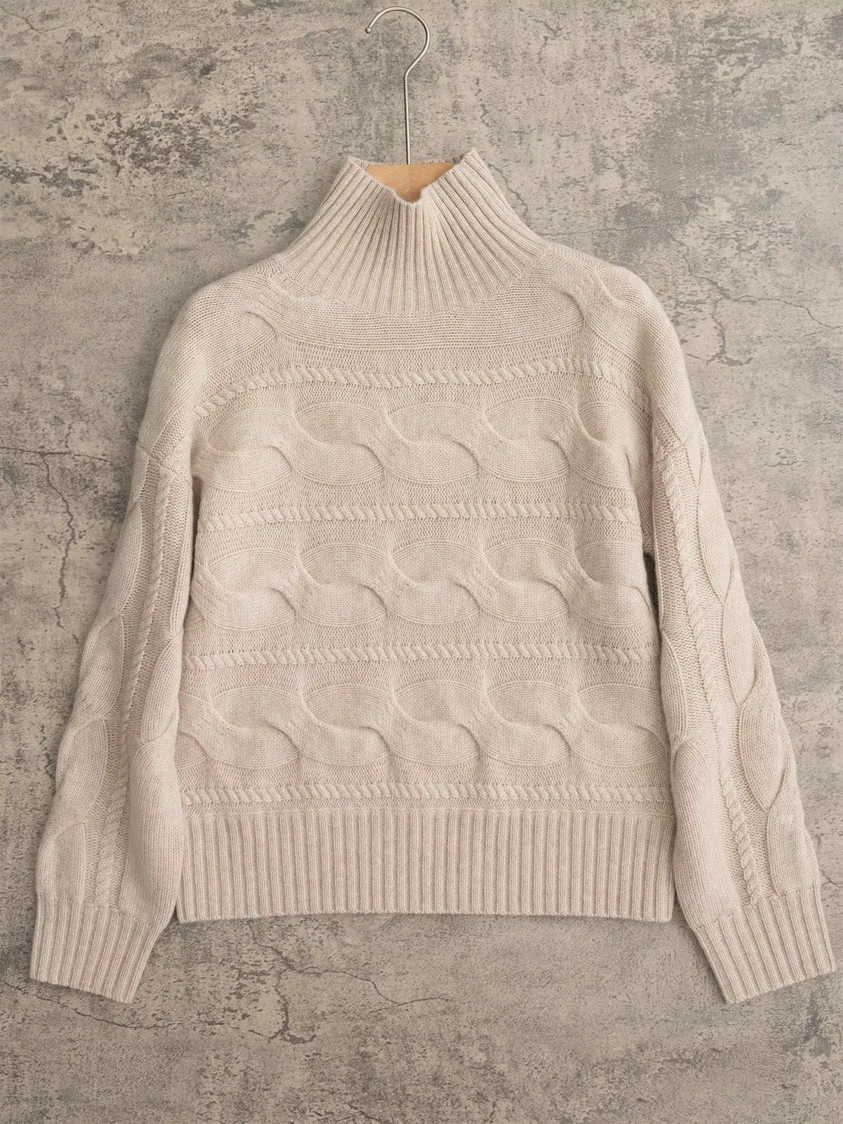 Women's beige cable-knit turtleneck jumper