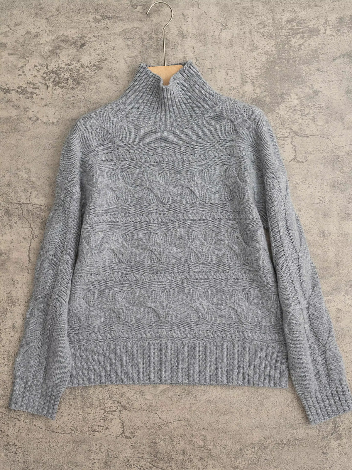 Women's grey cable-knit turtleneck jumper